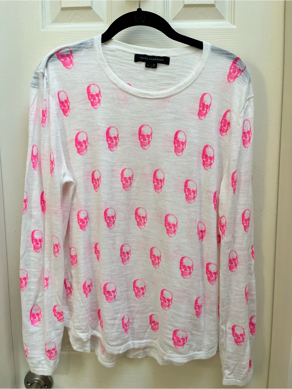 Women’s Skull Cashmere White Long Sleeve Top with Neon Pink Skull Print.